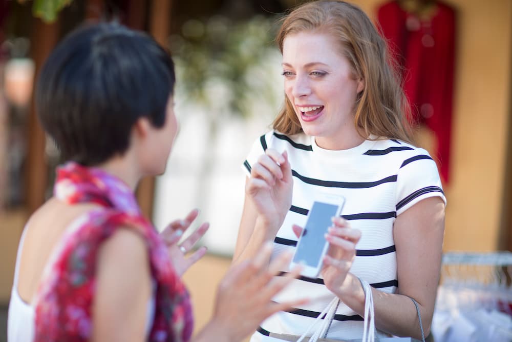 A customer interacting with a brand representative, showing a memorable brand recognition.